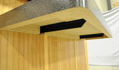 underneath a floating shelf showcasing two extended concealed brackets