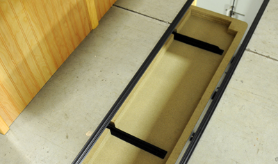 the bottom of a floating shelf showing our concealed brackets