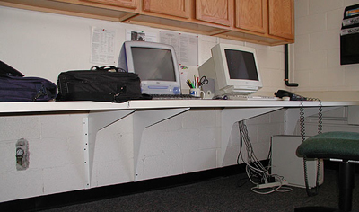 standard brackets holding computer stations