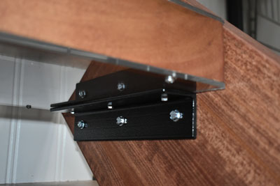 closeup of a stair tread bracket in use