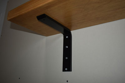 surface mounted flat bracket supporting a shelf